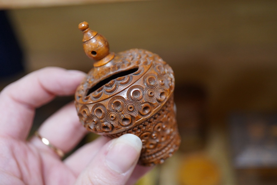 A 19th century Tunbridgeware tea caddy, 20cm wide, 11cm high, a Coquilla nut miniature money box and a collection of mixed decorative and novelty wooden money boxes (17). Condition - poor to fair